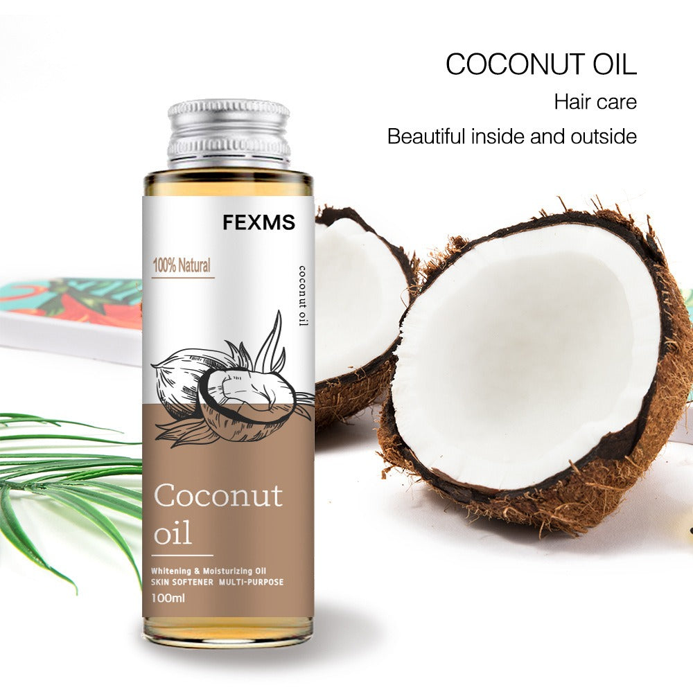 Coconut Massage Body Oil bottle with coconut halves; hydrating and nourishing skin care product.
