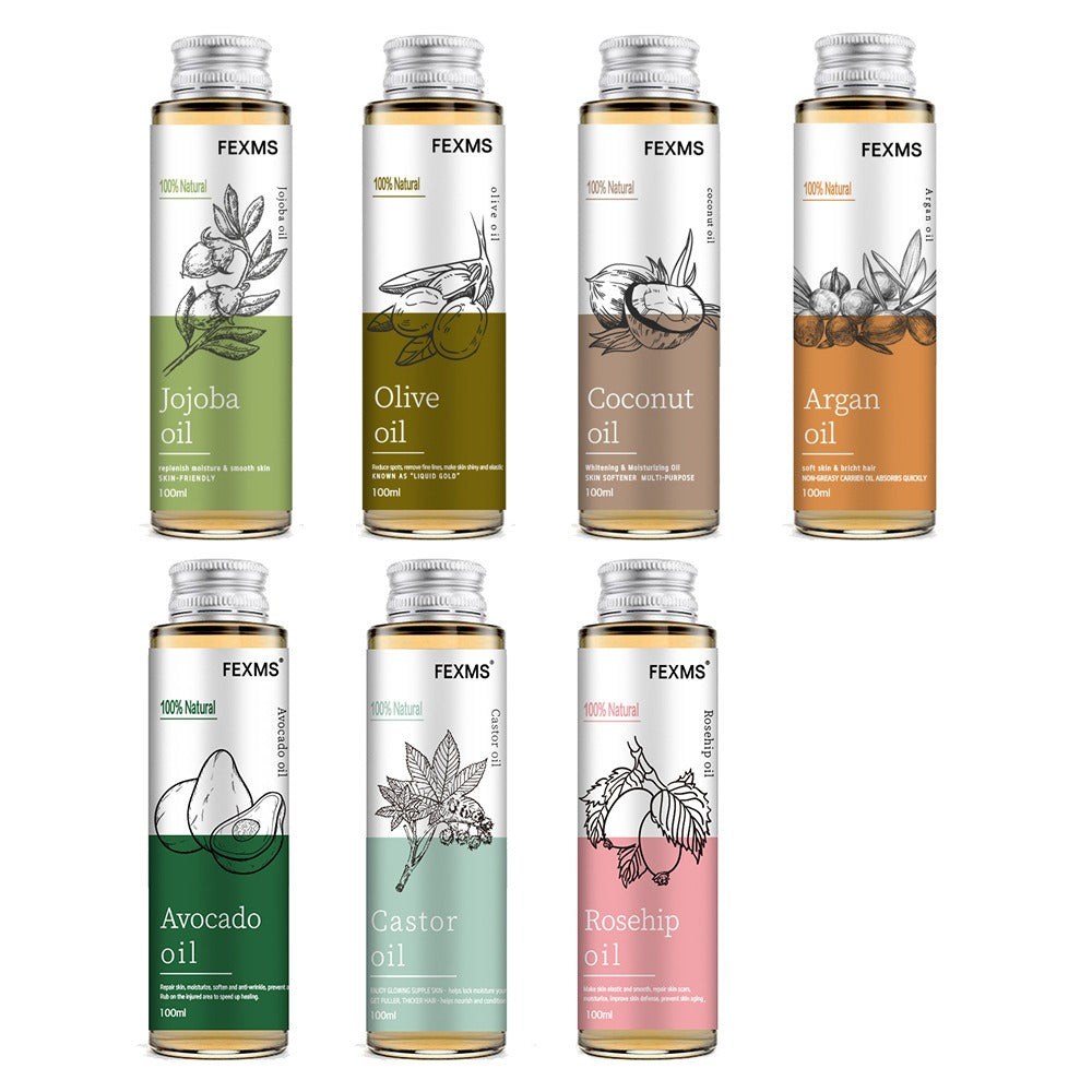 Various bottles of natural oils, including Coconut Massage Body Oil, arranged on a white background.