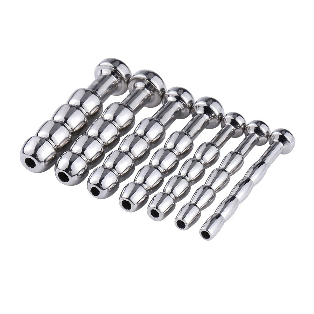 Silver stainless steel metal expansion plugs in various sizes for self-pleasure use.